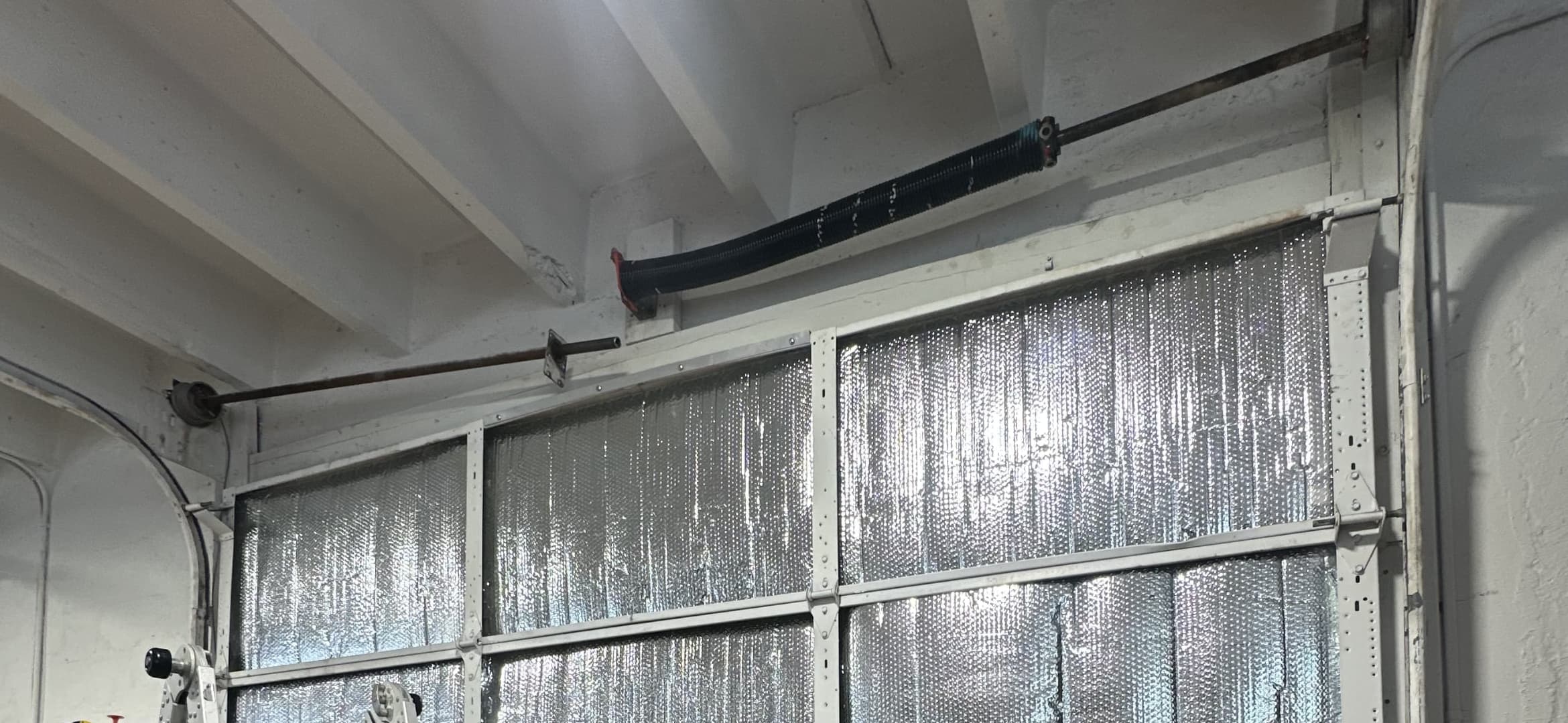 Professional garage door technician at work